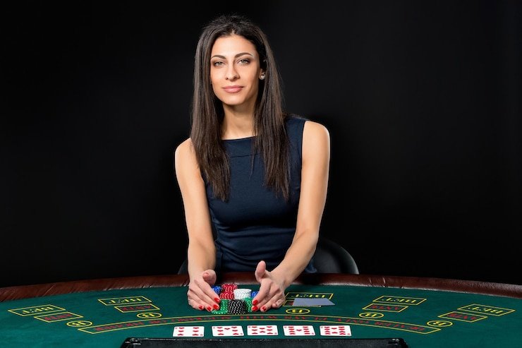 Close-up of live dealer handling cards and chips at rawit128 slot Grand Slam blackjack table
