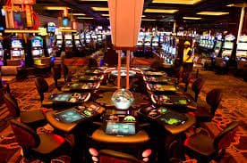 rawit128 slot live-dealer studio with multiple gaming tables